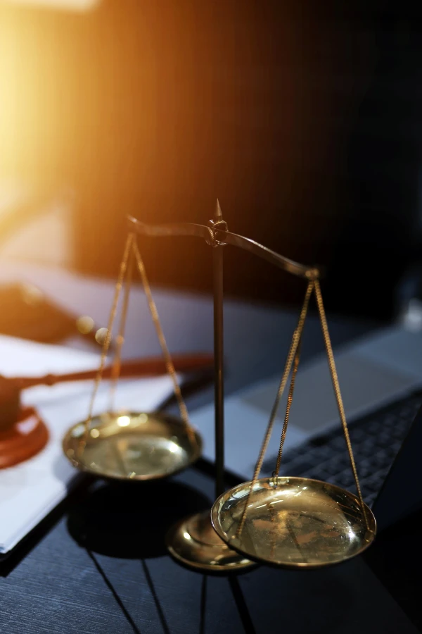 Justice scales with sunlight glow